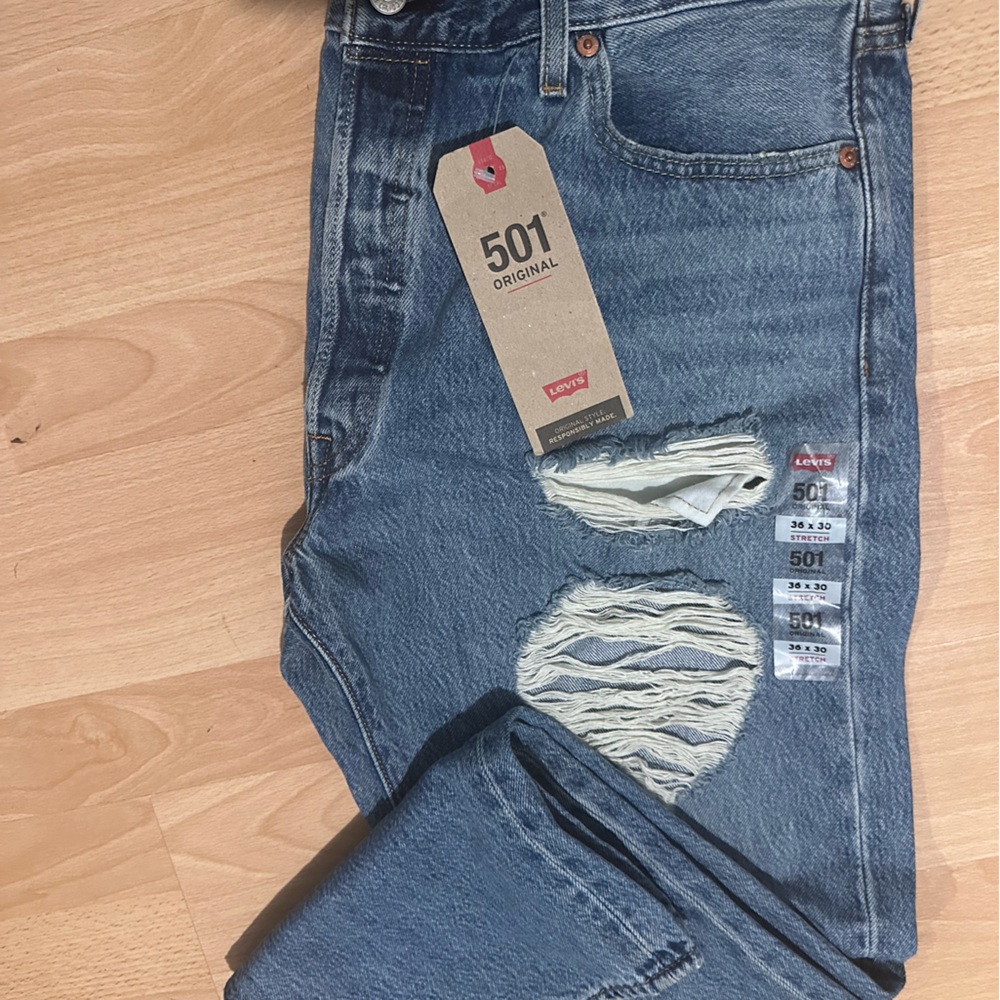 Levi’s women denim ripped straight leg 501 jeans in a size 36 X 30